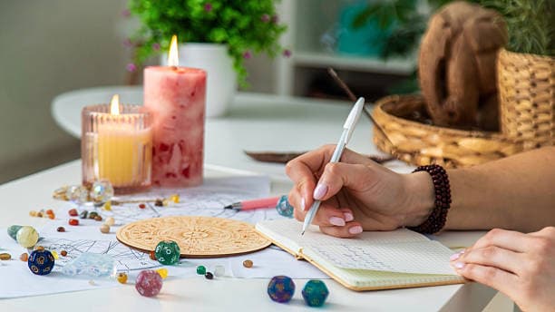 Woman astrologer draws a natal chart